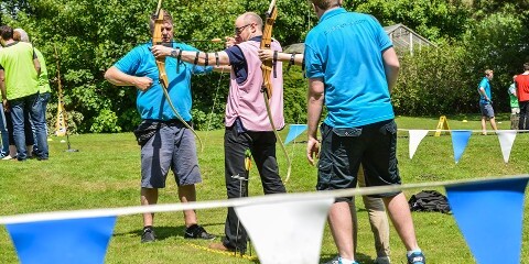 people in archery outdoor activity