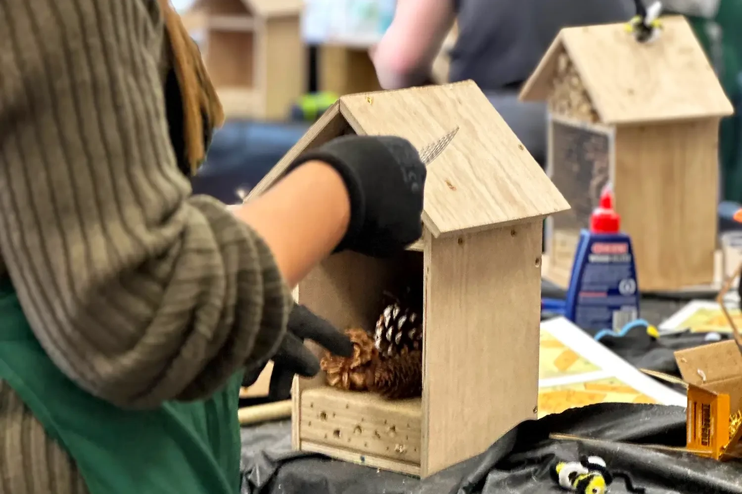 Bee hotel participant building bee hotel for bee conservation