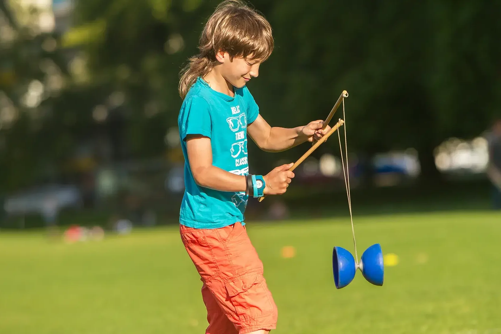 child learning circus skills at corporate family fun day