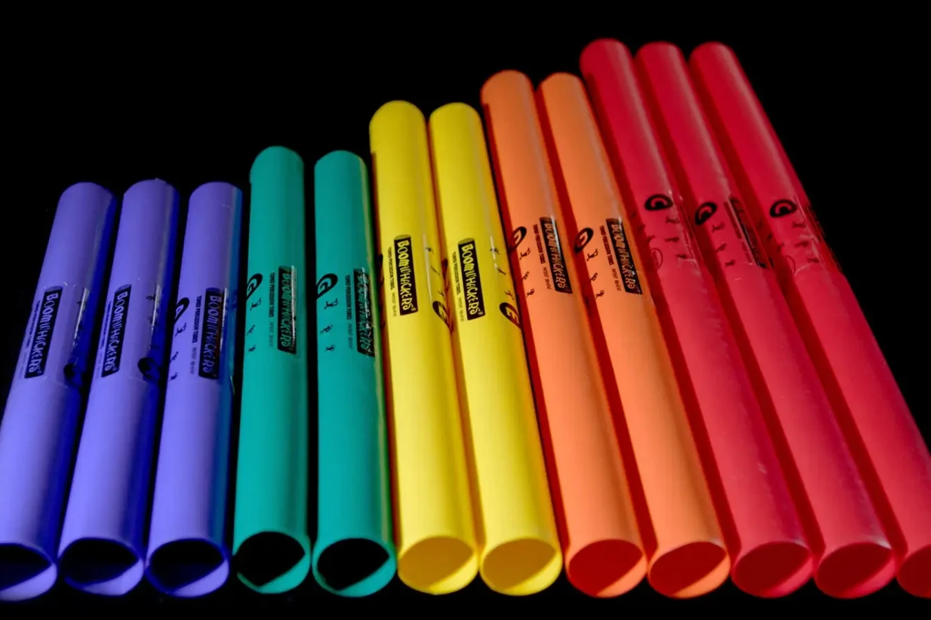 Colourful boomwhackers musical instruments aligned