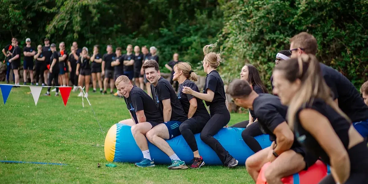 People participating in sport event during company summer fun day