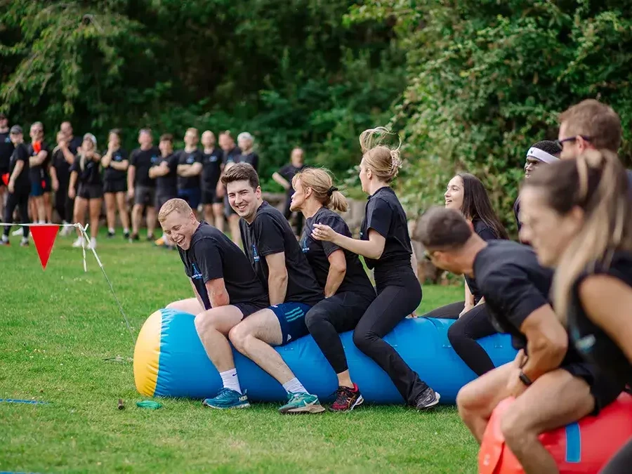 People participating in sport event during company summer fun day