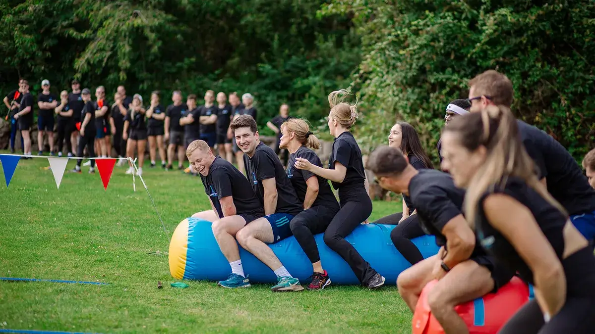 People participating in sport event during company summer fun day