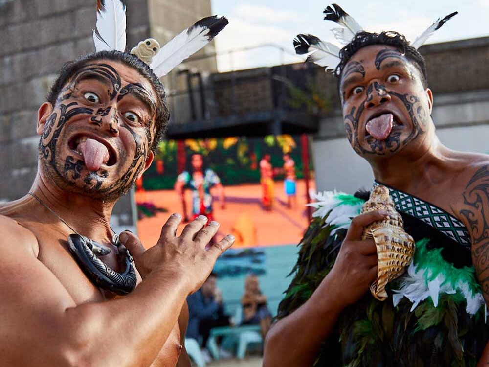 Two Maori men posing during a Haka