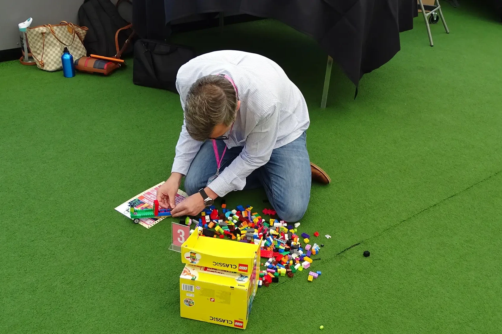 Man with LEGO in team building activity