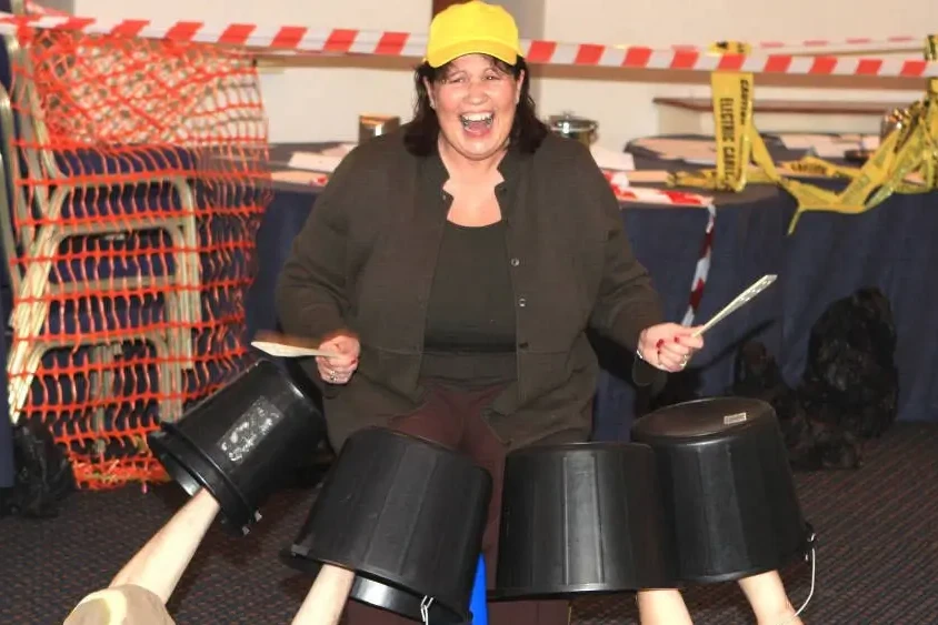 Junk Funk participant drumming on buckets