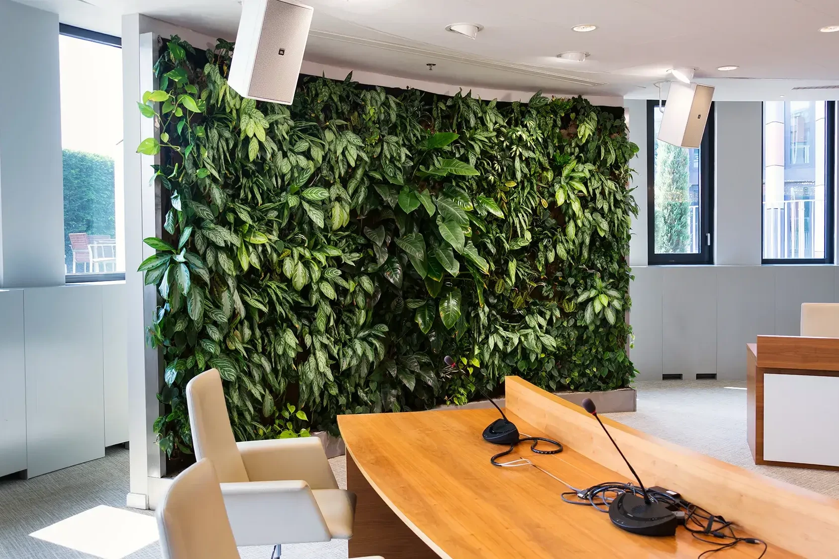 Large green living wall in office conference room