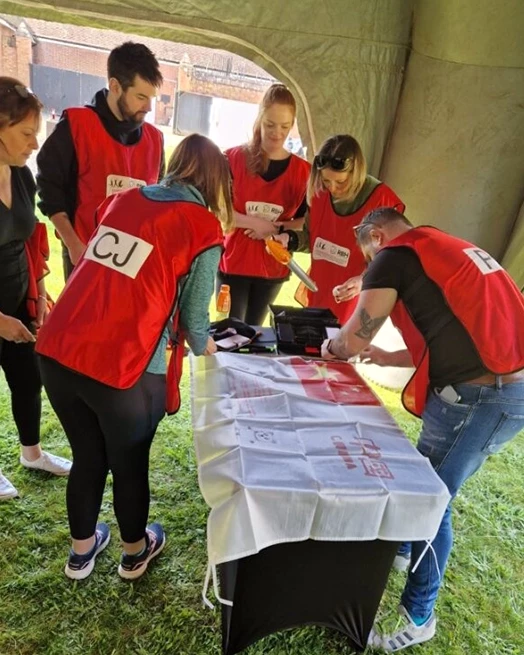 Team creating personalised Olympic flag in Corporate Olympic Sport Day
