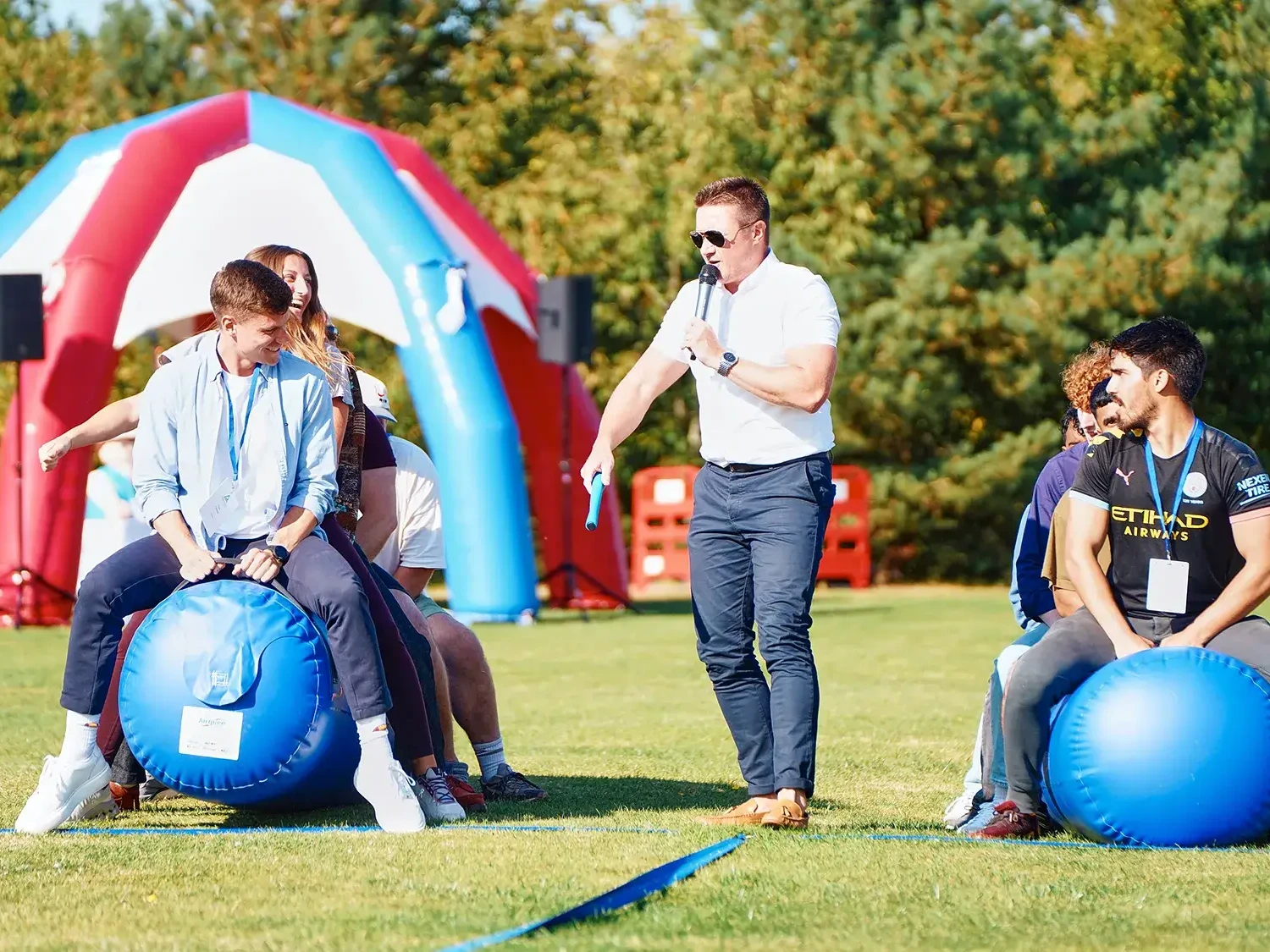 Teams competing in outdoor team building event