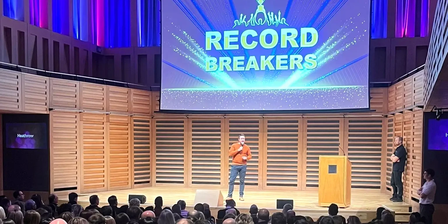 Team building host on stage at Record Breakers event