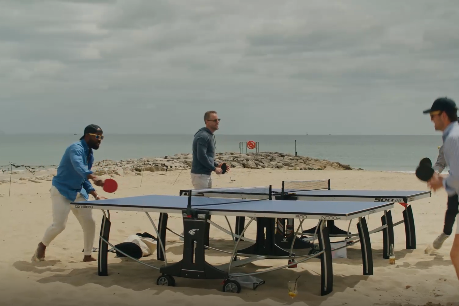 table tennis on the beach during company summer party