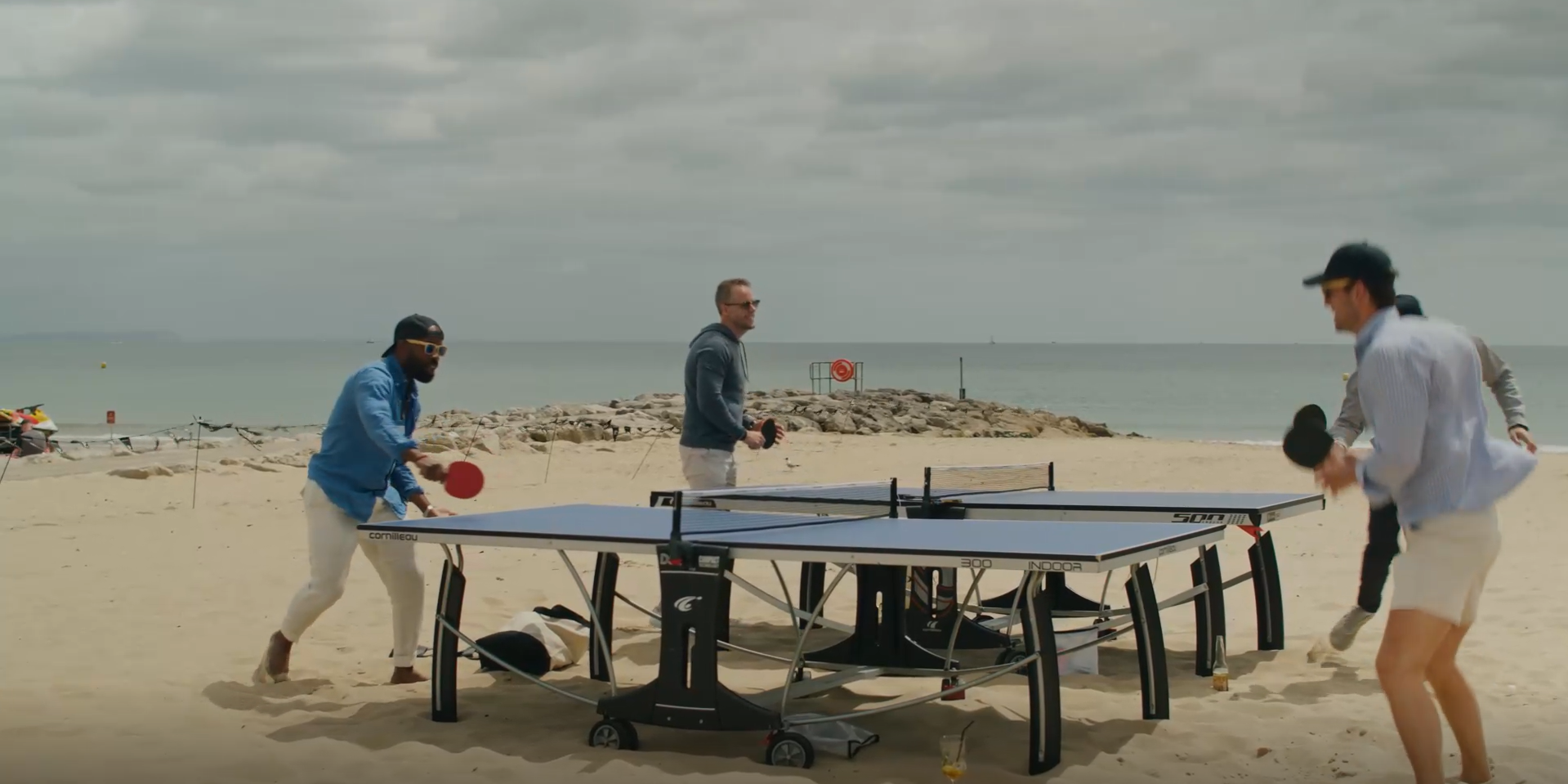 table tennis on the beach during company summer party