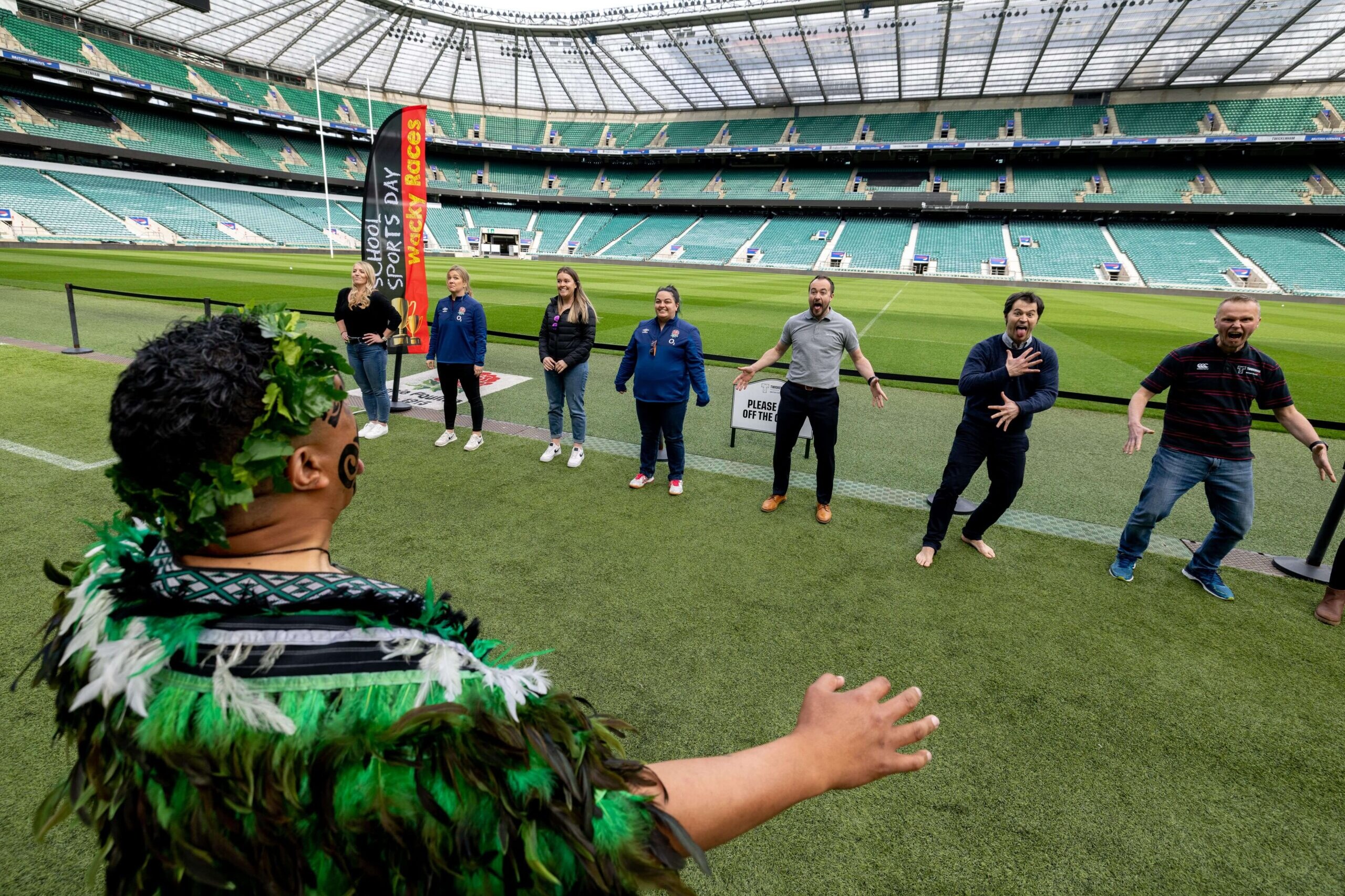 Group performing the Haka led by Maori instructor