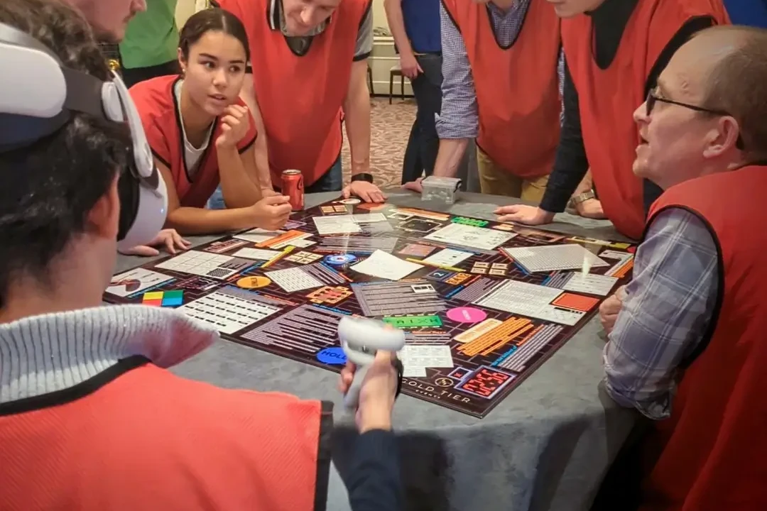 Team around a board game playing in VR team building game