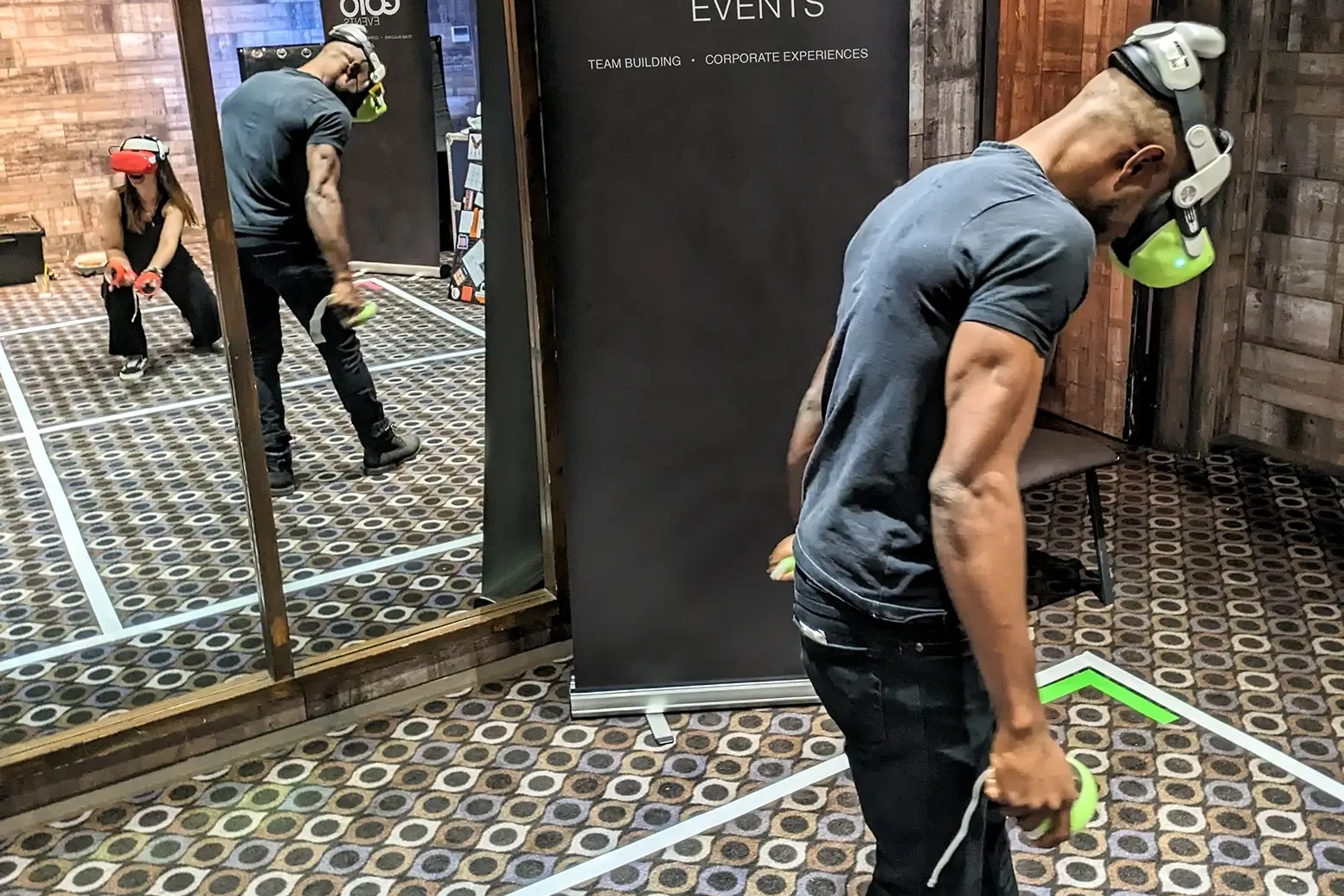 Man with VR set playing in VR Escape Room Team Building Activity