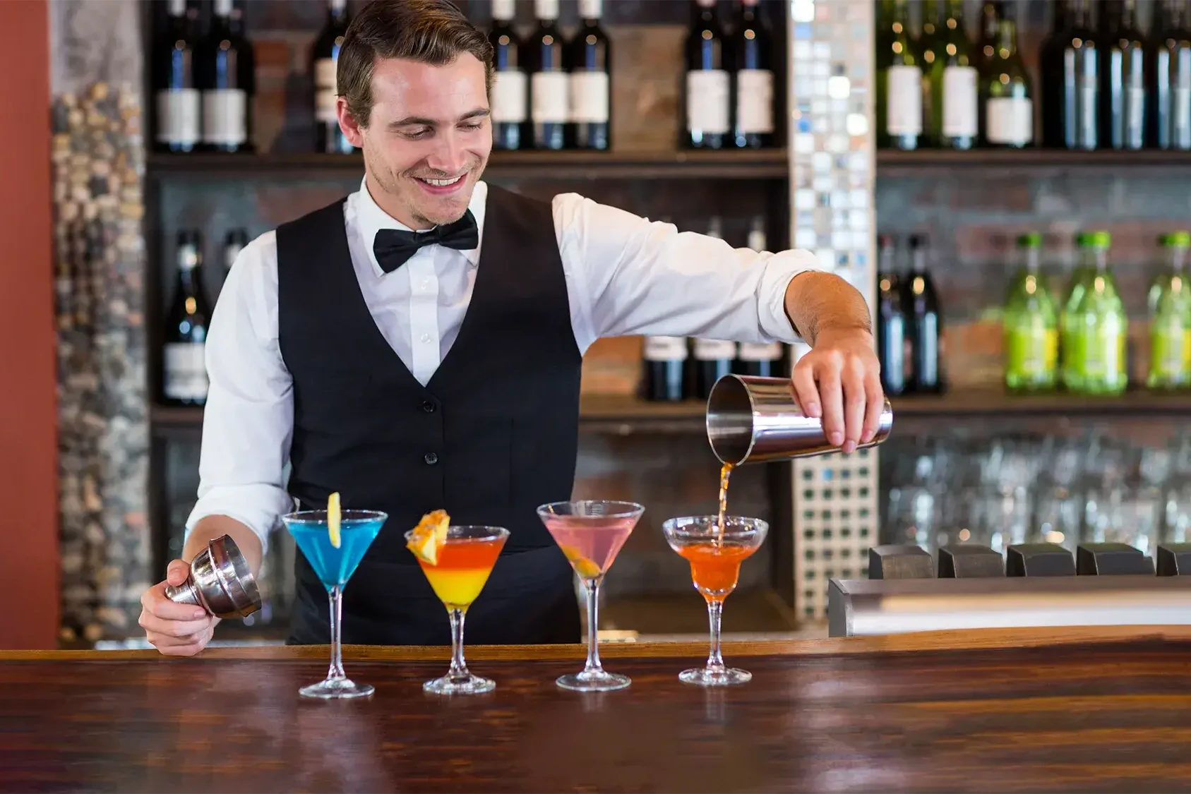 Mixologist demonstrating cocktail making in corporate team building event