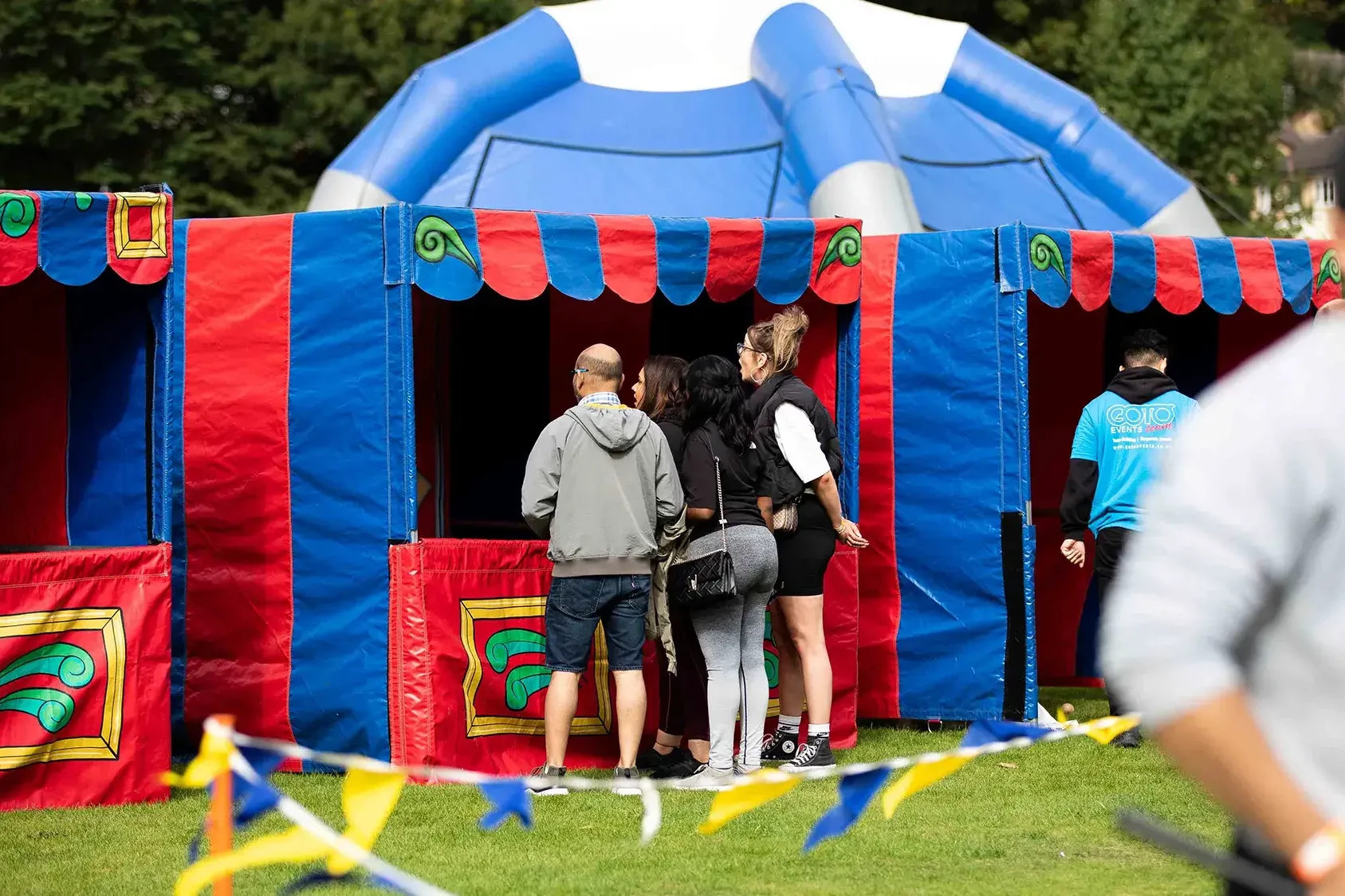 colorful stalls at outdoor corporate event