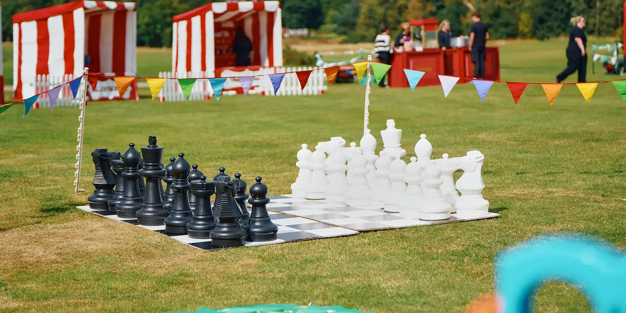 giant chess on green lawn in outdoor team building event