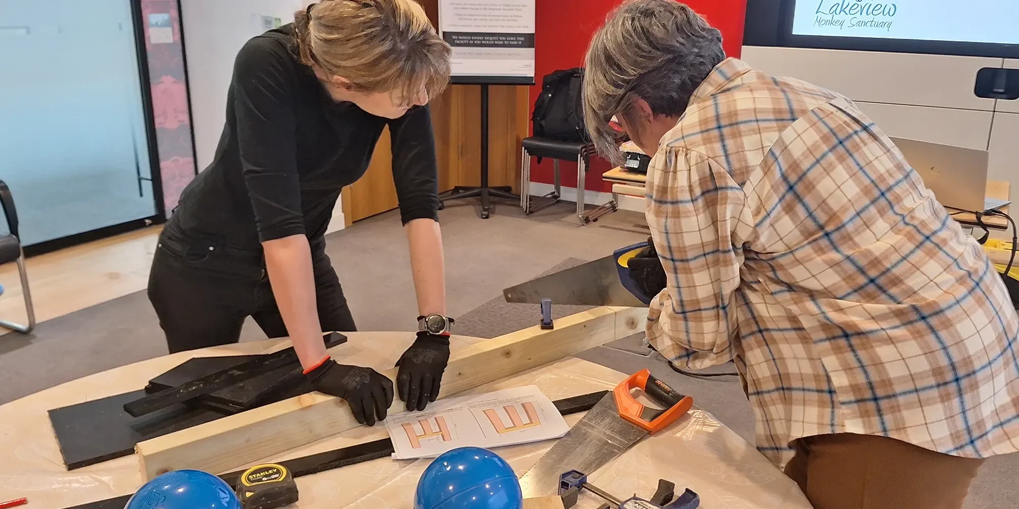 paws for a cause charity team building activity measuring for animal feeder build