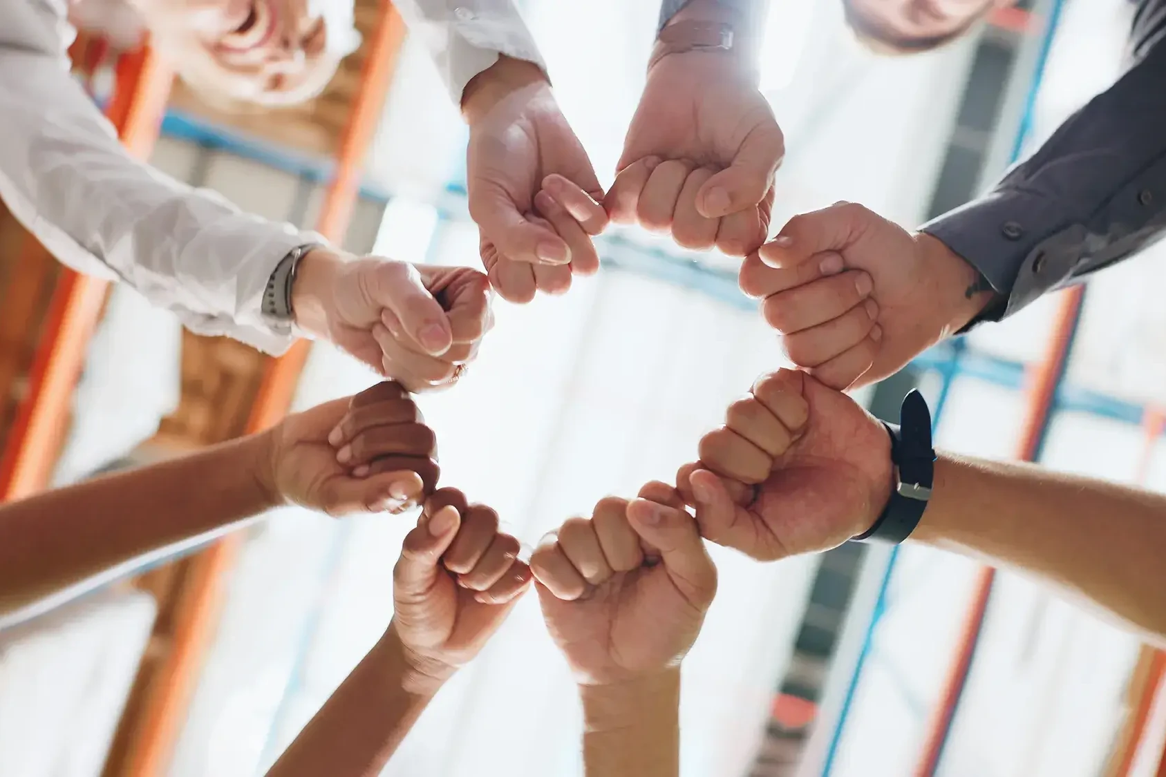 team building participants holding hands together