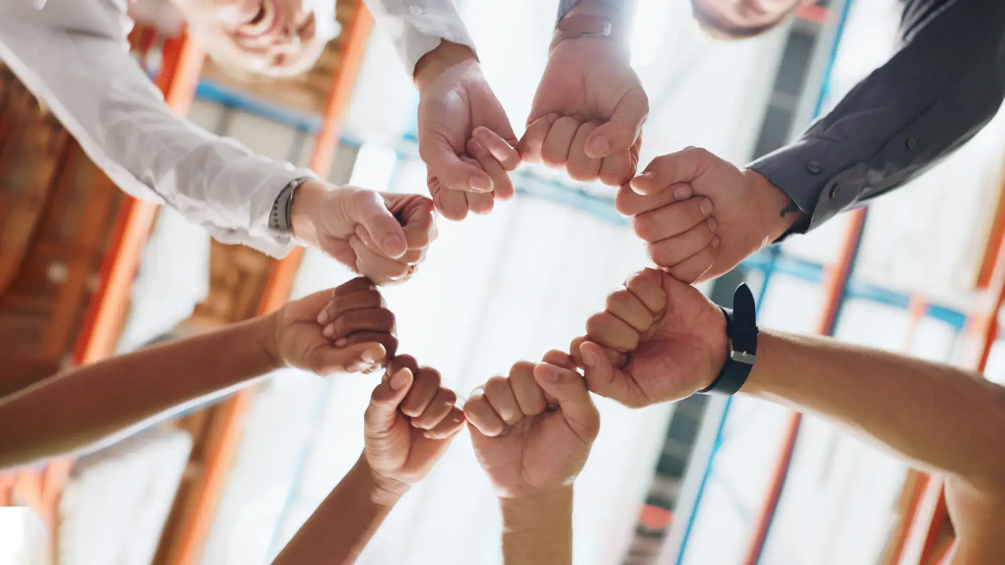 team building participants holding hands together